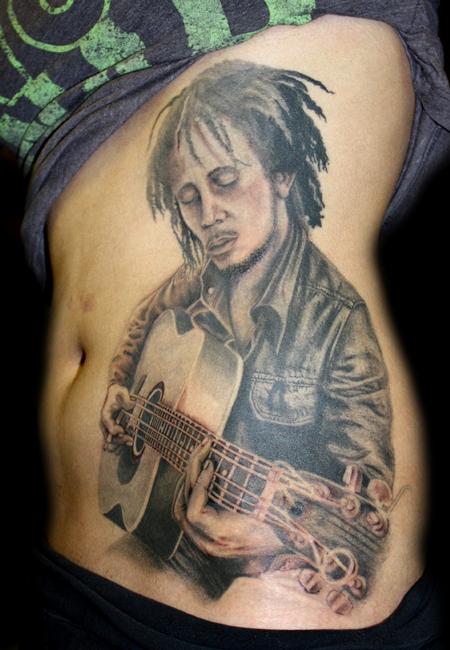 Angela Leaf - black and grey bob marley portrait tattoo